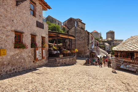 People walking through the Old Town with many shops and cafes on July 20, 2014 in Mostar, Bosnia and Herzegovina.のeditorial素材