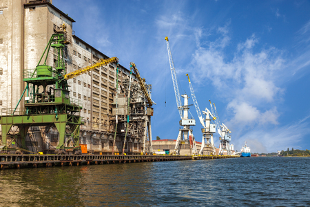 Old grain elevator whit cranes in port of Gdansk, Poland.の写真素材