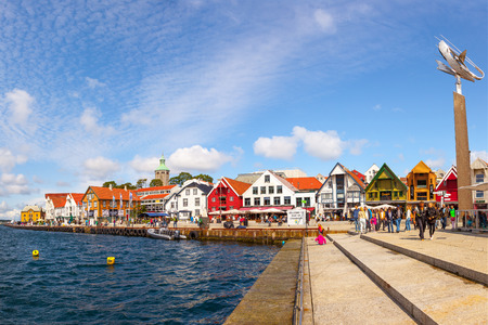 People at the quay port with many restaurants and pubs in the city center, on July 15, 2015 in Stavanger, Norway.のeditorial素材
