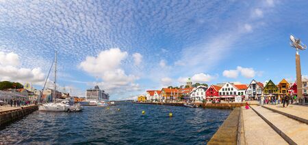 People at the quay port with many restaurants and pubs in the city center, on July 15, 2015 in Stavanger, Norway.のeditorial素材