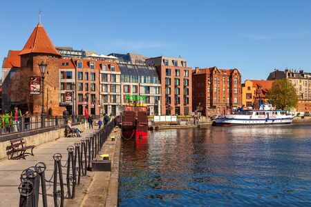 Street scene with view of Motlawa riverside and Hilton Hotel, on April 21, 2016 in Gdansk, Poland.のeditorial素材