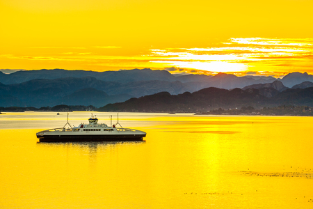 Sunrise over the mountains and the sea in Norway.の写真素材