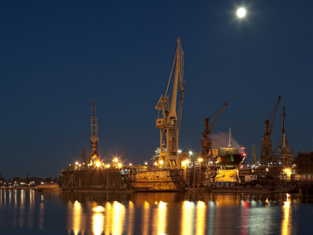 Dry dock in the moonlight at the shipyard in Gdansk, Poland.のeditorial素材