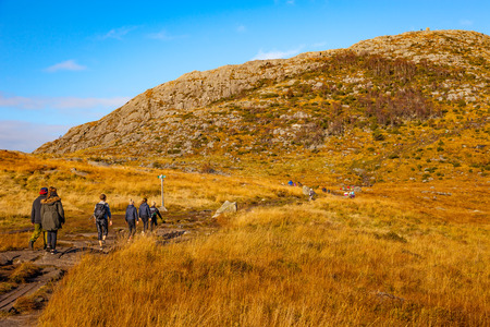 DALSNUTEN, NORWAY - OCTOBER 12, 2016: Unidentified group of tourists on hiking trail to Dalsnuten Top a famous tourist attraction in Norway.のeditorial素材