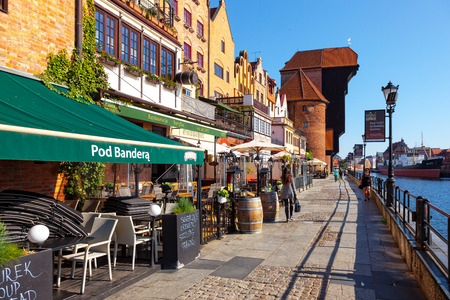 GDANSK, POLAND - MAY 19, 2017: Street scene with peoples walk on riverside with the characteristic...