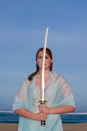 Attractive female model holding a samurai swordの写真素材