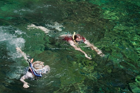 father&son are seeing the underworld ,andaman sea,krabi, thailandの写真素材