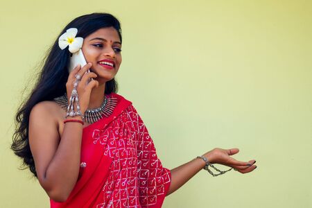 happy india business lady white toothy smile in traditional Indian sari clothes red wedding dress...