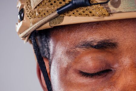 military army african male camouflage suit sorrow white background studio