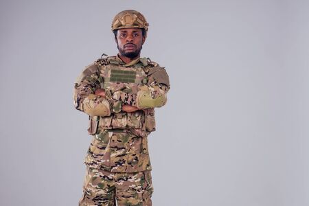 military army african male camouflage suit sorrow white background studioの写真素材