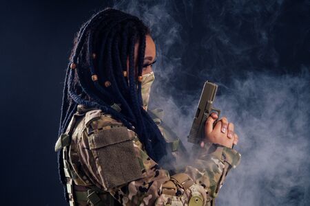 afro american indian army latin soldier in camouflage clothes hair dreadlocks evening makeup in mask...