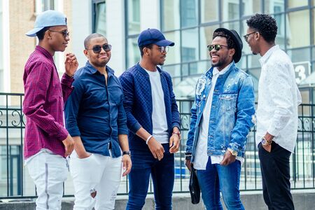 Group of many friends laughing out loud outdoor, sharing good and positive moodの写真素材