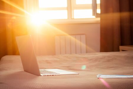 laptop at evening sun set close up in home .の写真素材