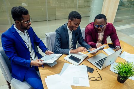 three business people working in conference roomの写真素材