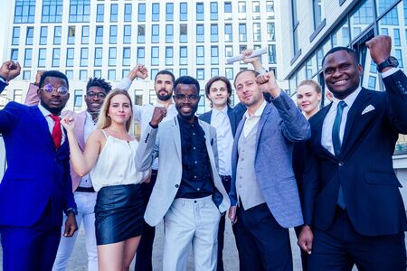 multinational and multiethnic corporate business people boss and colleagues partners standing and...