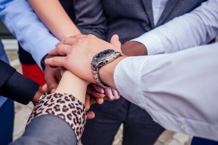 close up hands of group of multinational people businesswoman and business man at a business meeting handshake . teamwork conceptの写真素材