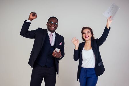 beautiful indian female business leader with multiracial business partner African American man...