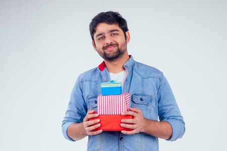 handsome turkey man giving gift boxes in studio white background.New year or Ekadashi concept