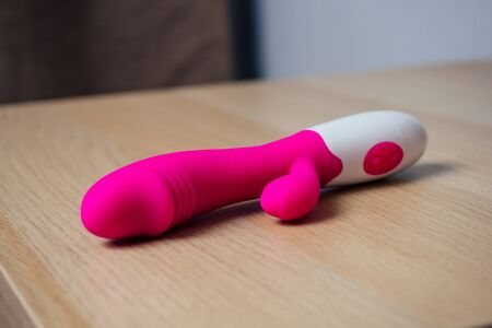 Sex toy for woman and man on chest of drawers bedside tableの写真素材