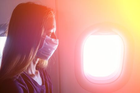 woman feeling bad in aeroplane fly afraidの写真素材