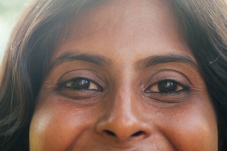Headshot of happy young Indian woman with nice hairの写真素材