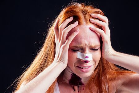 caucasian panic female cosmetic lifting procedure in studio pink background