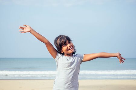 cute girl 7 or 8 years old Asian American mixed enjoying holidays.travel medical insurance conceptの写真素材