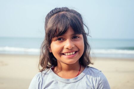 cute girl 7 or 8 years old Asian American mixed enjoying holidays.travel medical insurance concept