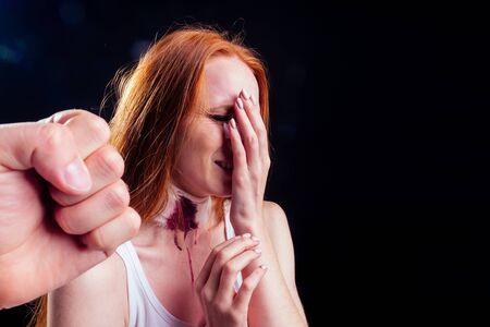redhaired ginger woman in black dark roomの写真素材