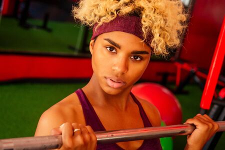 young african american woman activity working out in gym indoor
