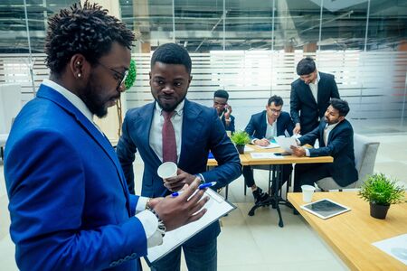 top view of team work high five a group of successful afro americans, europeans ,arabic and korean...