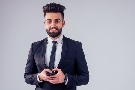 italian young success handsome black hair man in stylish business suit in studio isolate white...