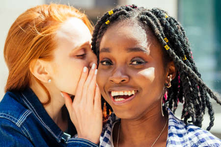 Happy brightful positive moments of two stylish girlsの写真素材