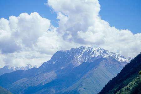 big Elbrus mountain in summe on cloudy day