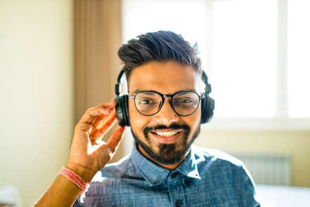 handsome bearded arabian man listen to musicの写真素材