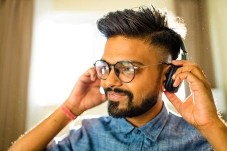 handsome bearded arabian man listen to musicの写真素材