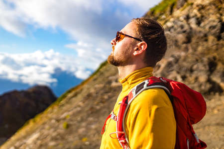 Man on top of mountain.