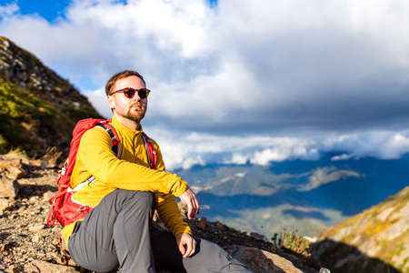 Man on top of mountain.