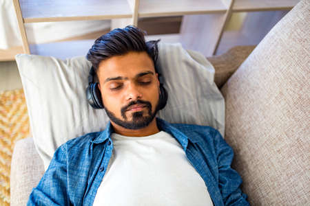 bearded arabian man listening audio meditationの写真素材