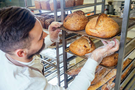 Retail trade concept , man owner of food factory using devices for online business order at...