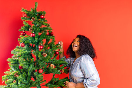afro spanish woman celebration christmas in silver dressの写真素材