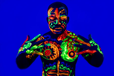 afro american man posing in studio shot with UV lightの写真素材