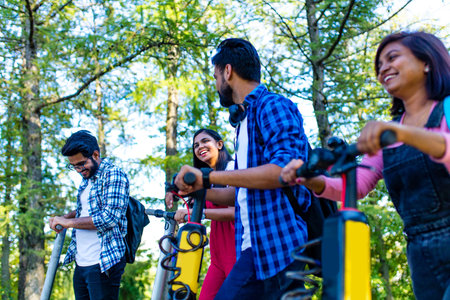 modern indian friends ride on segway in park in Indiaの写真素材