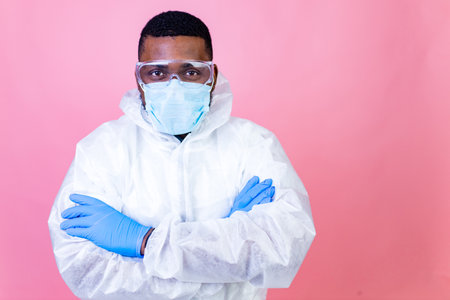 Virus SARS-CoV-2 vaccination concept : man in pink studio wall backgroundの写真素材