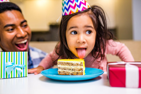 single father and his little daughter celebration birth day in kitchenの写真素材