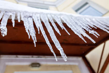 icicles hanging from a roof winter russian dayの写真素材