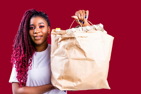 hispanic american volunteer supporting food donation conceptの写真素材