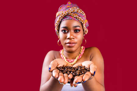 beautiful africa-american woman with turban ower the head in studioの写真素材