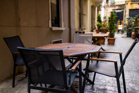 Empty tables and chairs , nobody tourist in the street curfew tourismの写真素材