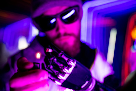 cyber robot hand close up of male handle use lighters going to smoking a cigarette in neon studio